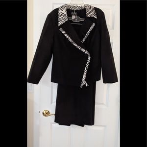 Black dress suit edge with zebra striped lapel, and skirt split.
